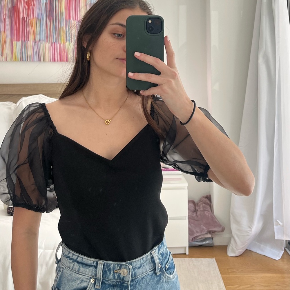 Black express new with tags never worn black puff mesh sleeves. Fitted top